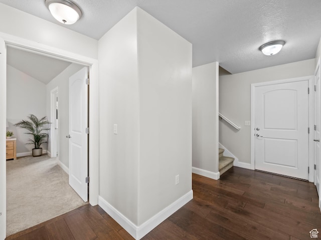 1262 S 50 E Unit 3, Lehi, UT 84043 - hallway featuring a textured ceiling, baseboards, dark wood finished floors, and stairs