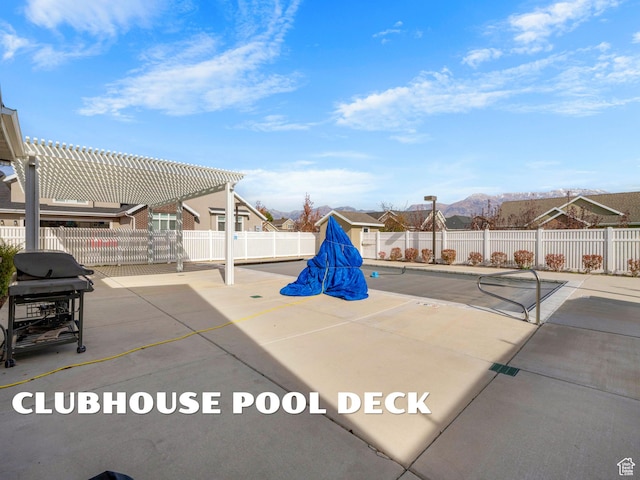1262 S 50 E Unit 3, Lehi, UT 84043 - view of patio featuring a pergola, grilling area, a fenced backyard, and a mountain view