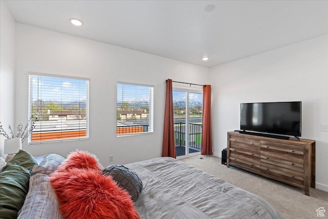 carpeted bedroom featuring access to exterior, recessed lighting, and baseboards
