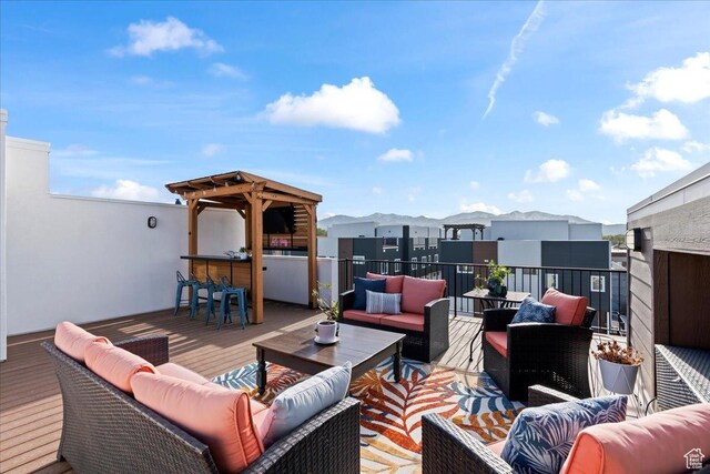deck with outdoor dry bar and an outdoor hangout area