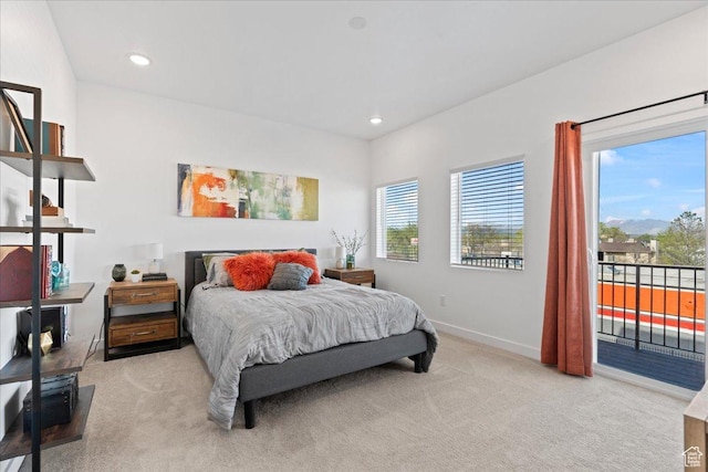 bedroom with light carpet, recessed lighting, access to exterior, and baseboards
