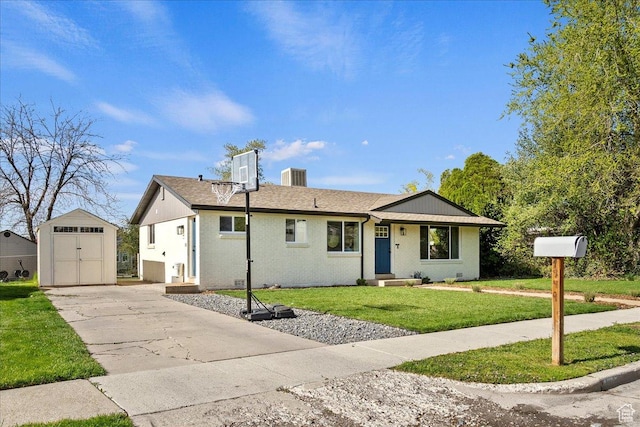 ranch-style home with central AC, an outdoor structure, a storage unit, concrete driveway, and a front lawn
