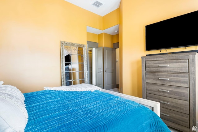 bedroom featuring visible vents