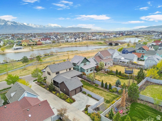bird's eye view featuring a water and mountain view and a residential view