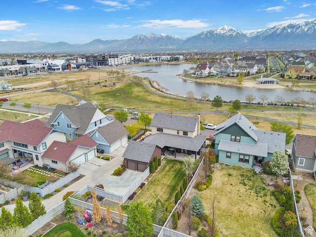 bird's eye view featuring a residential view and a water and mountain view