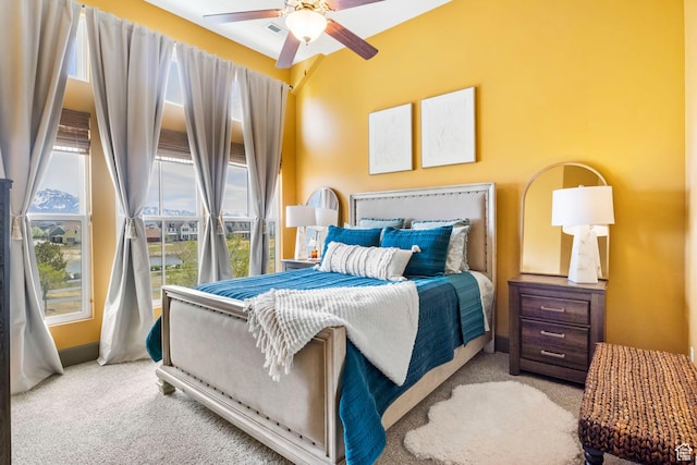 carpeted bedroom featuring visible vents and ceiling fan