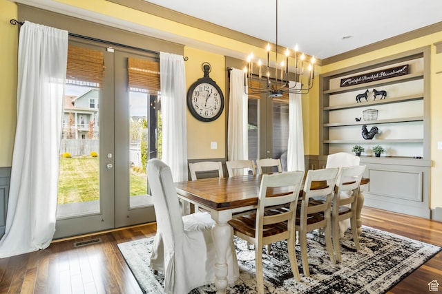 dining space with french doors, an inviting chandelier, and plenty of natural light
