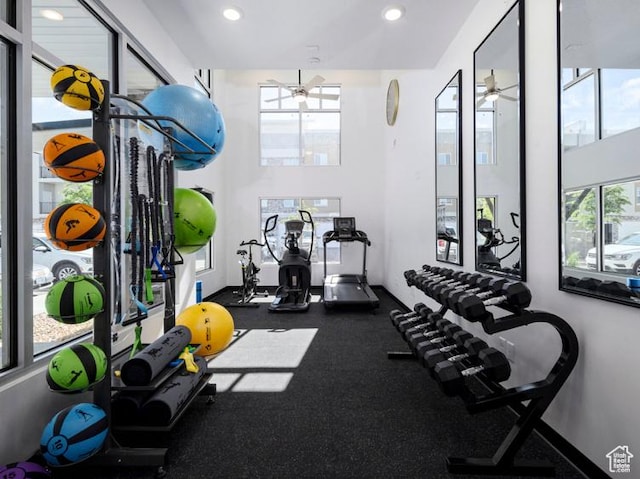 workout area with a ceiling fan, plenty of natural light, and recessed lighting