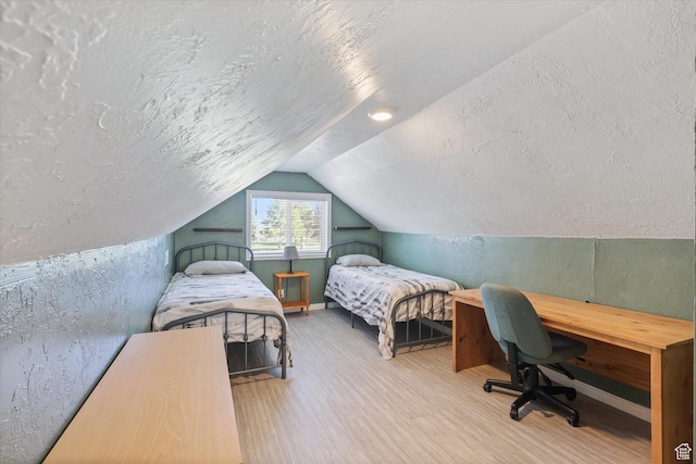 44 E 400 N, Manti, UT 84642 - bedroom featuring a textured ceiling, wood finished floors, a textured wall, and vaulted ceiling