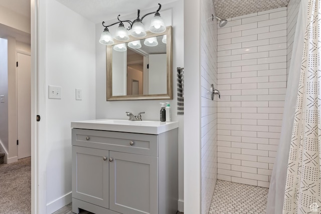 bathroom with a stall shower and vanity