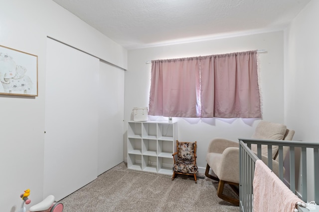 carpeted bedroom featuring a closet