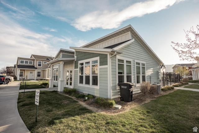 1221 W 2415 S, Nibley, UT 84321 - view of home's exterior with a yard and board and batten siding