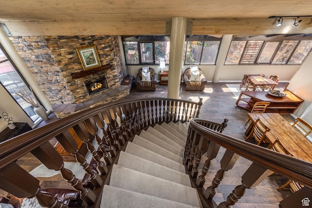 1485 Empire Ave Unit 506, Park City, UT 84060 - stairs featuring a stone fireplace and baseboards