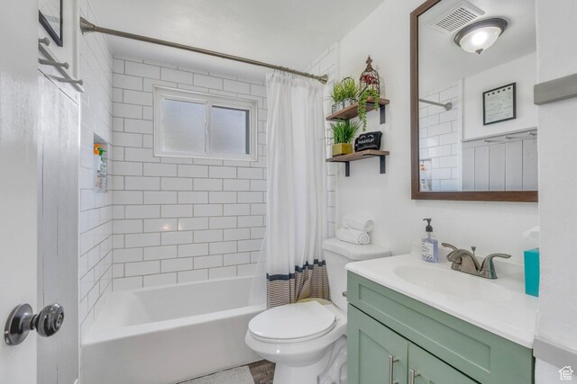 full bathroom featuring toilet, visible vents, vanity, and shower / tub combo with curtain