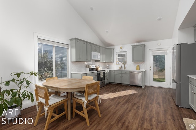 3131 Applewood Dr, Bountiful, UT 84010 - dining area featuring dark wood-style flooring and high vaulted ceiling