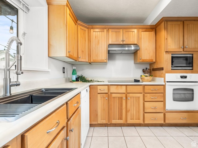 4866 W Diamondleaf Way S, West Jordan, UT 84081 - kitchen with light tile patterned floors, white appliances, under cabinet range hood, light countertops, and a sink