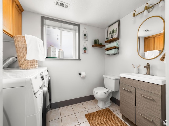 4866 W Diamondleaf Way S, West Jordan, UT 84081 - bathroom with visible vents, toilet, washing machine and clothes dryer, tile patterned floors, and baseboards
