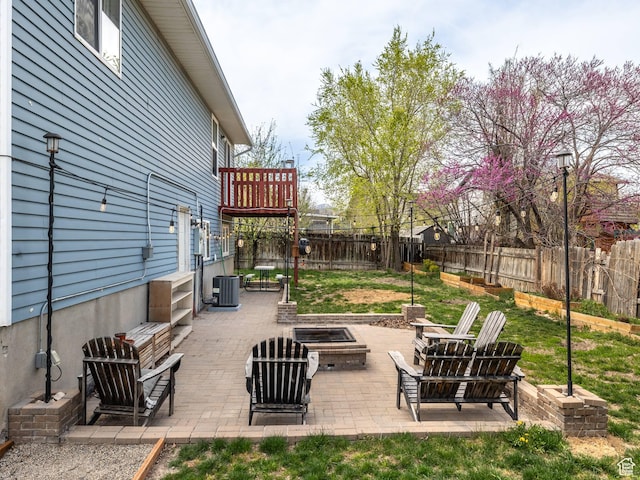 4866 W Diamondleaf Way S, West Jordan, UT 84081 - view of patio / terrace with a fenced backyard, cooling unit, and an outdoor fire pit