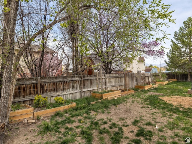 4866 W Diamondleaf Way S, West Jordan, UT 84081 - view of yard with fence and a vegetable garden