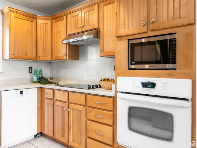 4866 W Diamondleaf Way S, West Jordan, UT 84081 - kitchen featuring light tile patterned floors, light countertops, white appliances, and under cabinet range hood
