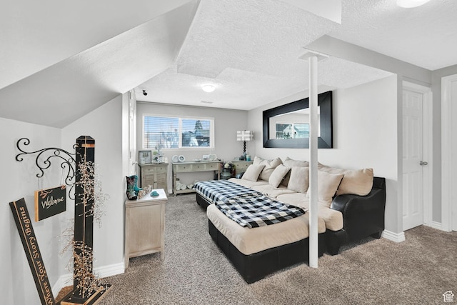 carpeted bedroom with baseboards and a textured ceiling