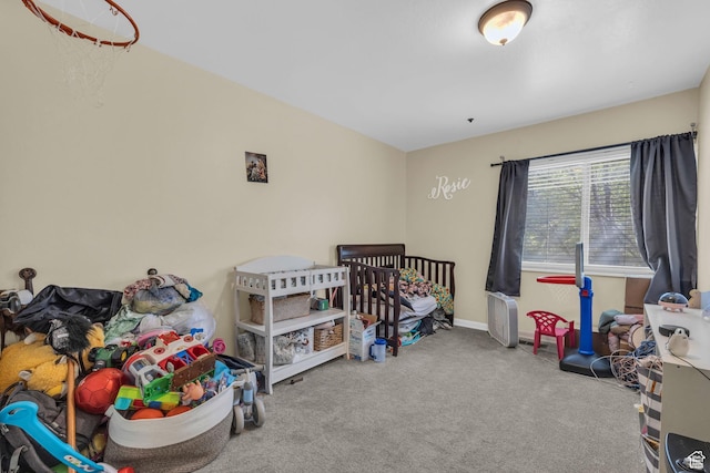 carpeted bedroom with baseboards