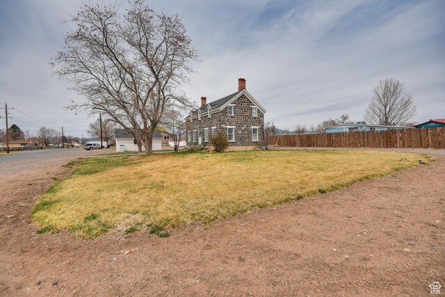 view of yard featuring fence