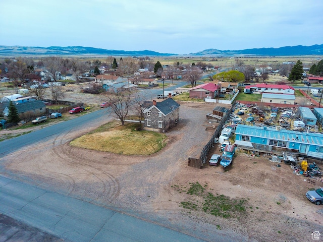 birds eye view of property featuring a mountain view