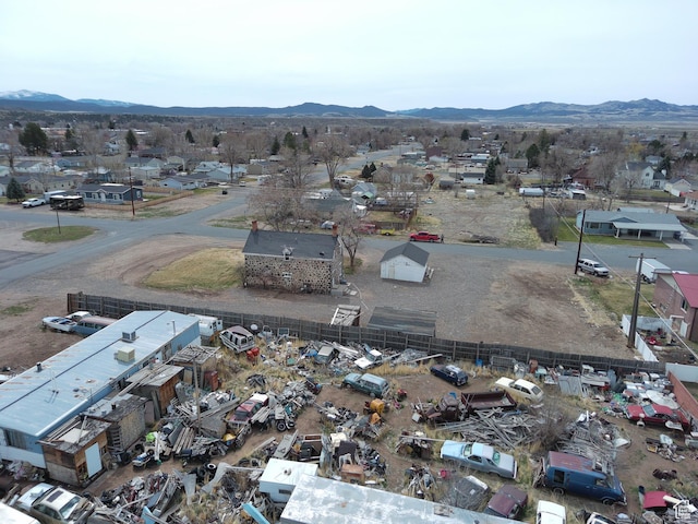 birds eye view of property with a mountain view and a residential view