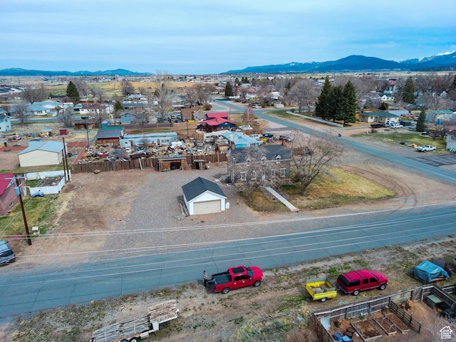 birds eye view of property with a mountain view