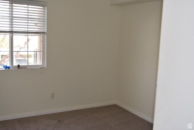 1617 W Treille Ct Unit I-5, West Valley City, UT 84119 - unfurnished room featuring a wealth of natural light, carpet flooring, and baseboards