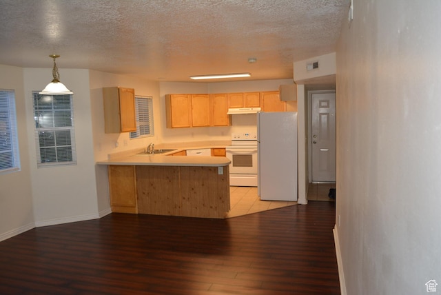 1617 W Treille Ct Unit I-5, West Valley City, UT 84119 - kitchen featuring a peninsula, a textured ceiling, light wood-type flooring, white appliances, and light brown cabinets