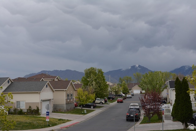 1617 W Treille Ct Unit I-5, West Valley City, UT 84119 - view of road with a residential view, curbs, and a mountain view