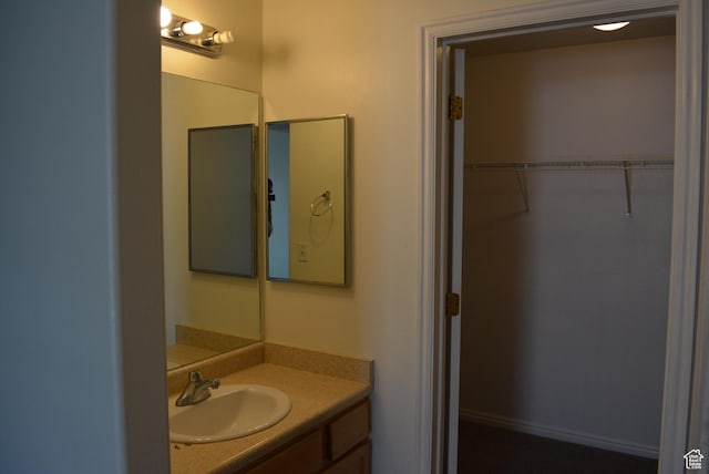 1617 W Treille Ct Unit I-5, West Valley City, UT 84119 - bathroom with a spacious closet and vanity