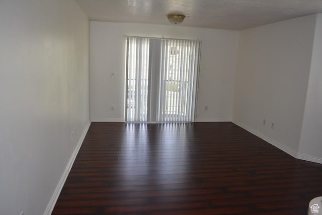 1617 W Treille Ct Unit I-5, West Valley City, UT 84119 - empty room with wood finished floors and baseboards