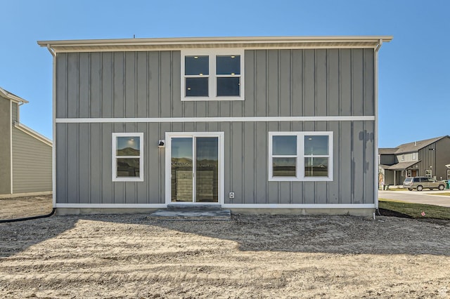 back of property with board and batten siding