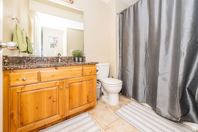 bathroom with toilet, tile patterned floors, vanity, and a shower with curtain