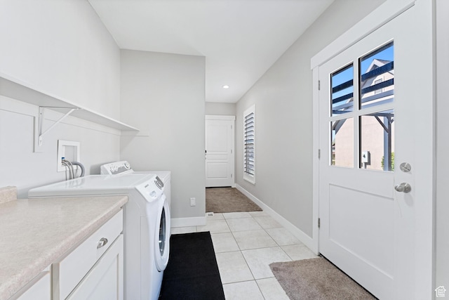 clothes washing area featuring baseboards, recessed lighting, light tile patterned flooring, and washer and clothes dryer