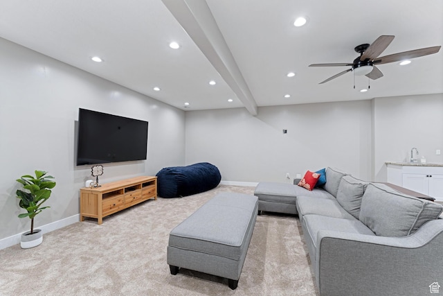 living area featuring recessed lighting, a ceiling fan, light colored carpet, and baseboards