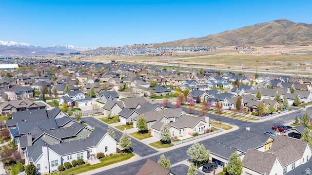 drone / aerial view featuring a residential view and a mountain view