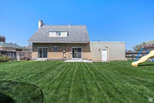 282 E 9545 S, Sandy, UT 84070 - rear view of property with a lawn, roof with shingles, fence, a playground, and a chimney