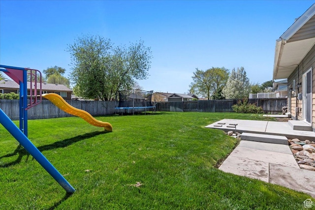 282 E 9545 S, Sandy, UT 84070 - view of yard with a patio area, a fenced backyard, a trampoline, and a playground