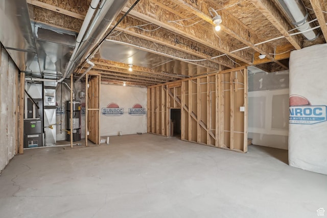 unfinished basement with secured water heater and heating unit