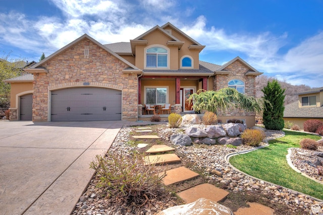 craftsman-style house with stone siding, covered porch, a garage, stucco siding, and driveway
