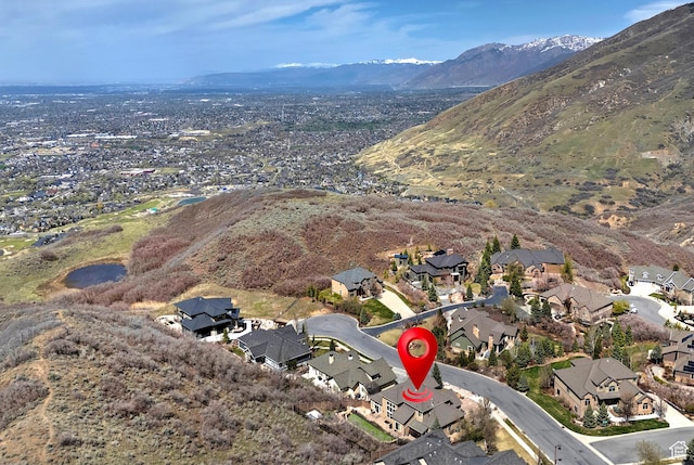birds eye view of property featuring a mountain view and a residential view