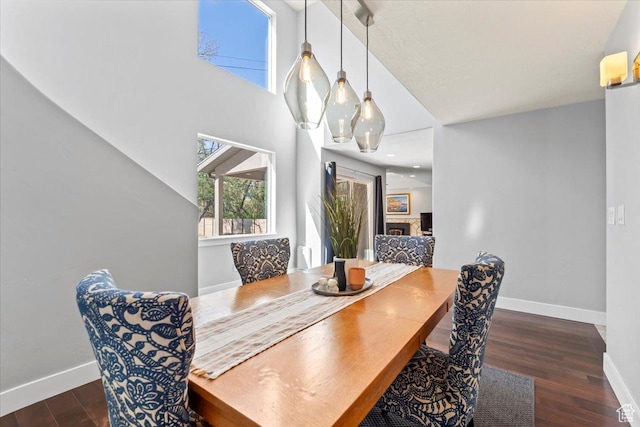 dining room with wood finished floors and baseboards