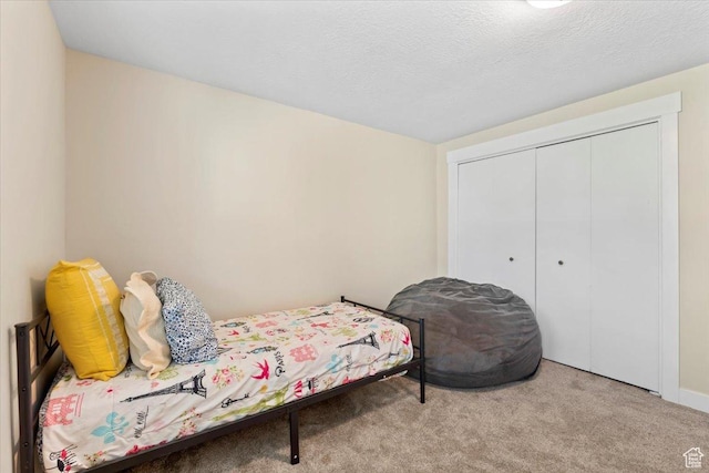 bedroom featuring a closet and carpet