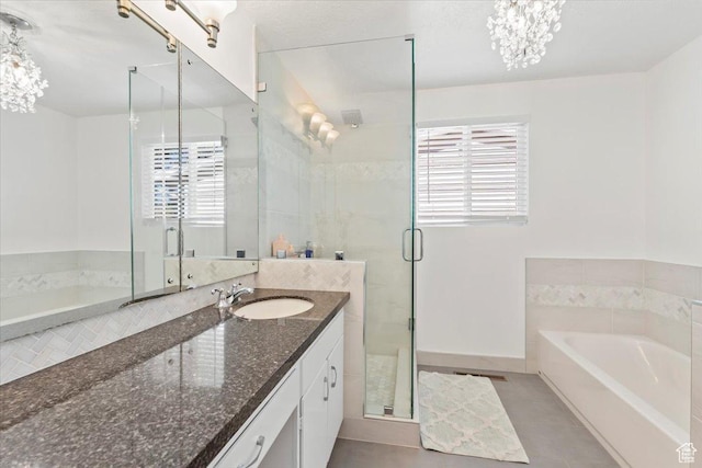 full bath with a shower stall, tile patterned floors, vanity, and a wealth of natural light
