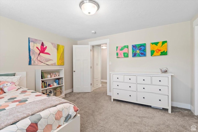 bedroom with light carpet and baseboards