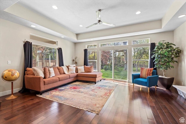 living area with hardwood / wood-style floors, recessed lighting, a ceiling fan, and a wealth of natural light